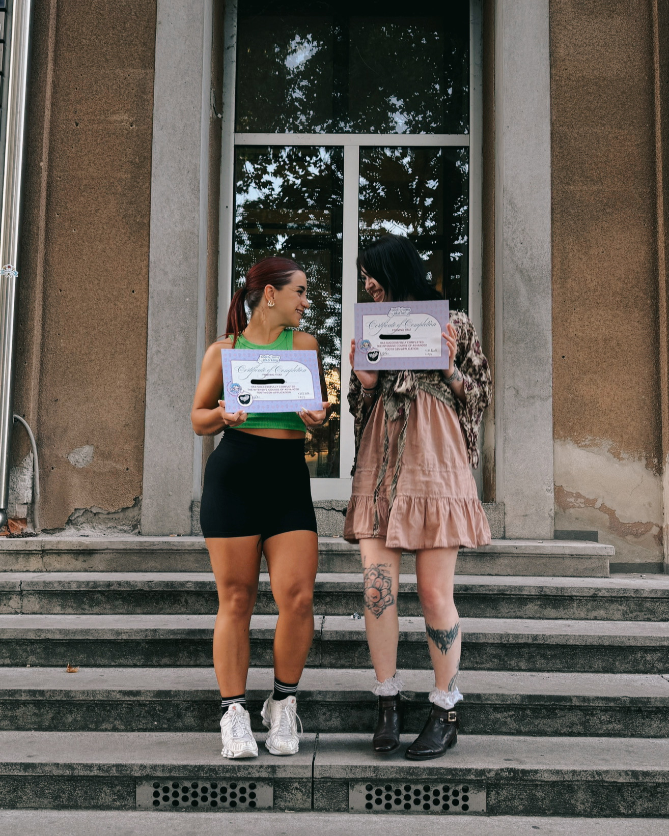 Graduates holding their tooth gem course certificates